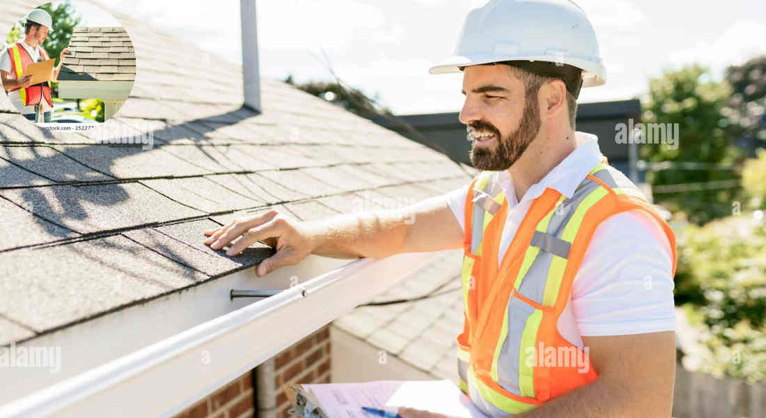 a man standing on the roof of a house